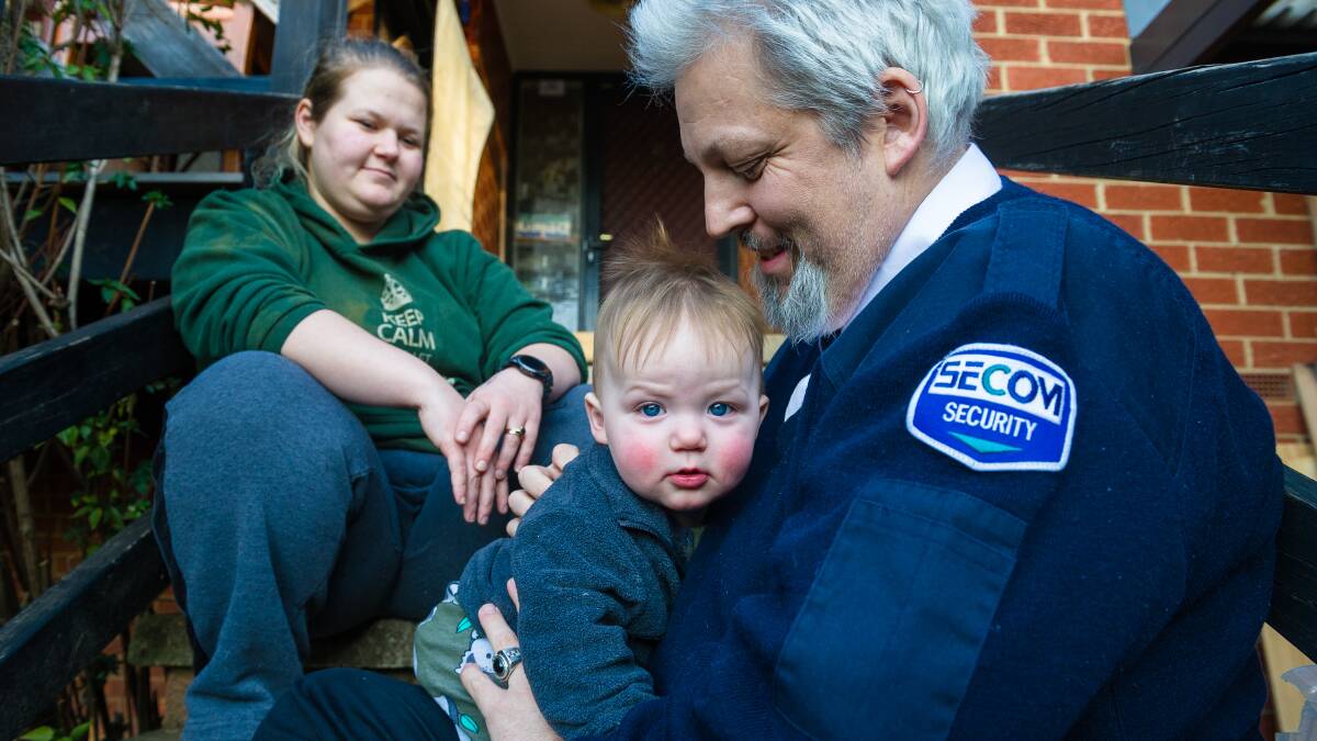 Security guard Pete Martin, with his 11-month son, Hendrix, and wife, Courtney. Picture: Elesa Kurtz