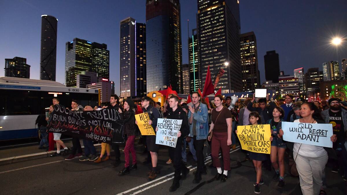 Climate change protesters march through the streets of Brisbane on August 9. Picture: AAP