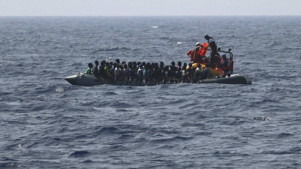 A rubber migrant boat in distress off Libya. The people were rescued and taken to Italy. Picture: Medecins Sans Frontieres