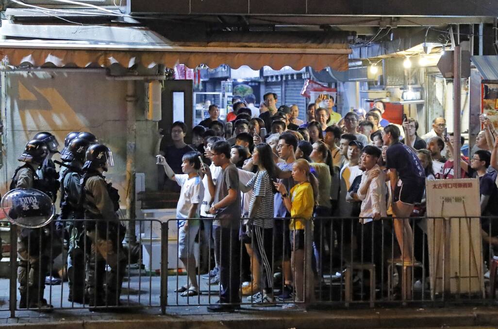 Riot police face off with protesters in Hong Kong. Picture: AP