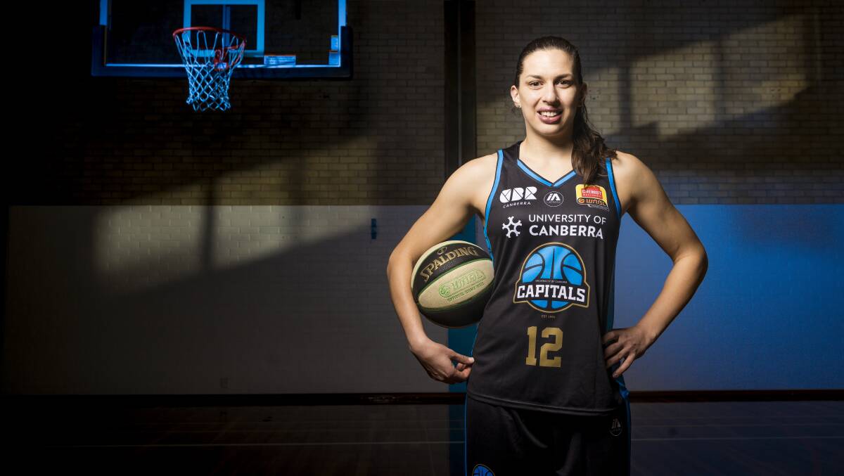 Marianna Tolo with a jersey adorned with the new Canberra Capitals logo. Picture: Sitthixay Ditthavong
