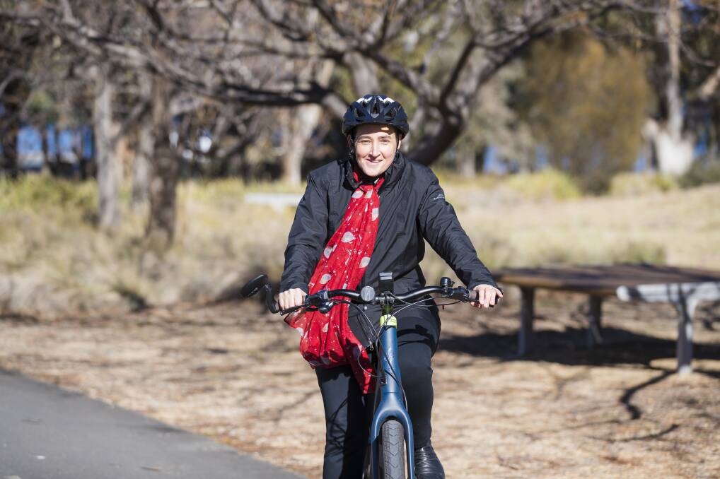 Australian National University physics professor Jodie Bradby, who rides about seven kilometres to work on shared paths, using her electric bike. Picture: Sitthixay Ditthavong
