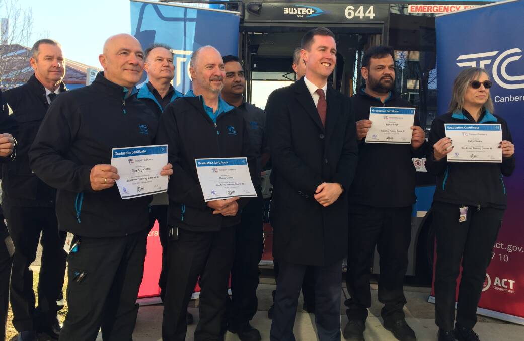 Transport Minister Chris Steel, announcing new weekend bus timetable after mass cancellations. He's alongside eight new bus drivers that have completed training. Picture: Andrew Brown