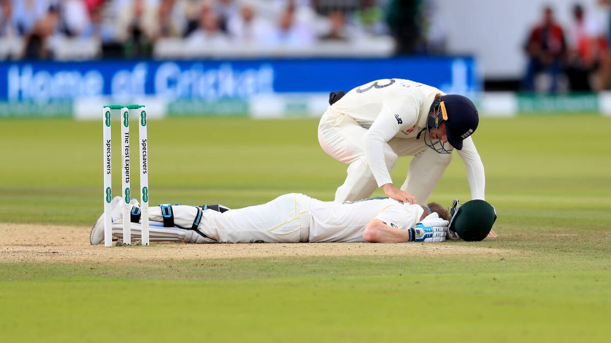 Australia's Steve Smith ends up on the floor after being hit by the ball during day four of the Ashes Test match at Lord's, London. Picture: PA