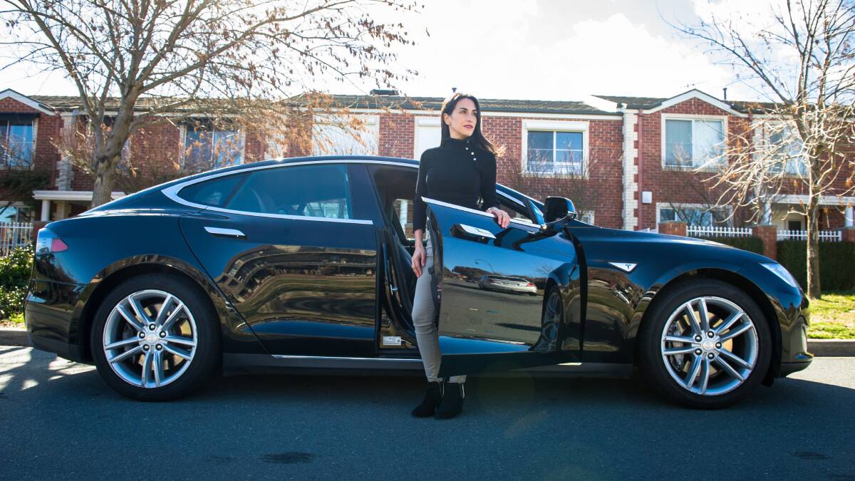 Evee electric car owner Lorena Wieshamm with her Tesla. Picture: Elesa Kurtz