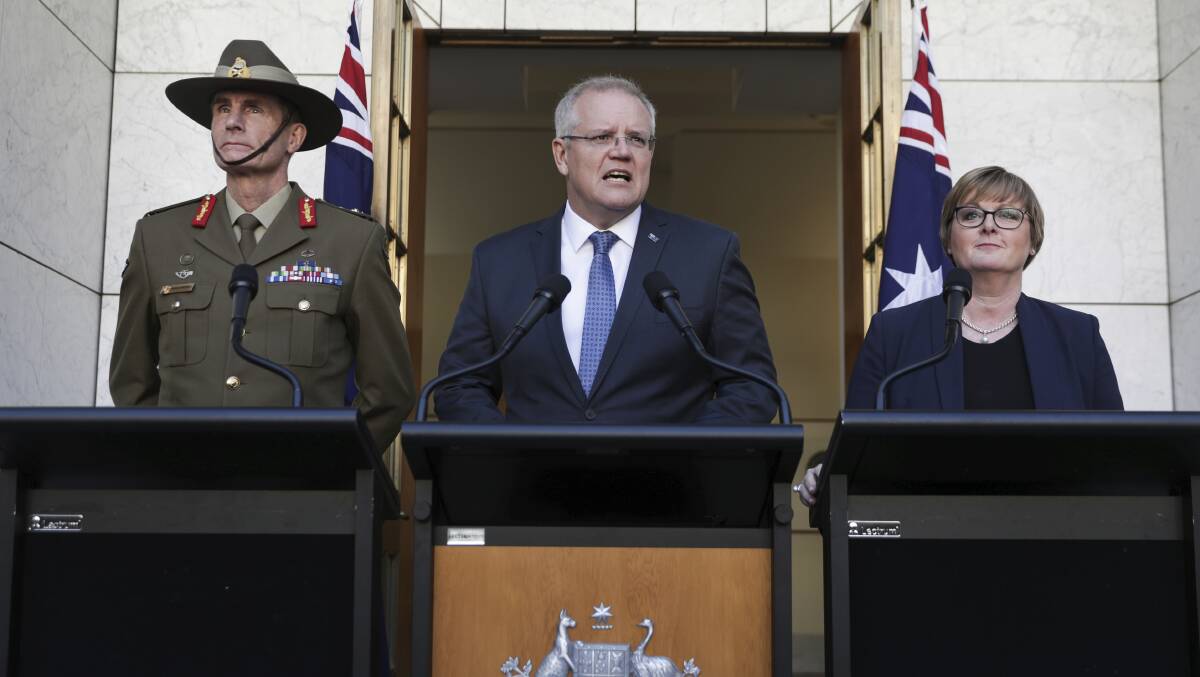 Chief of the Defence Force General Angus Campbell, Prime Minister Scott Morrison and Minister for Defence Linda Reynolds at Parliament House. Picture: Alex Ellinghausen
