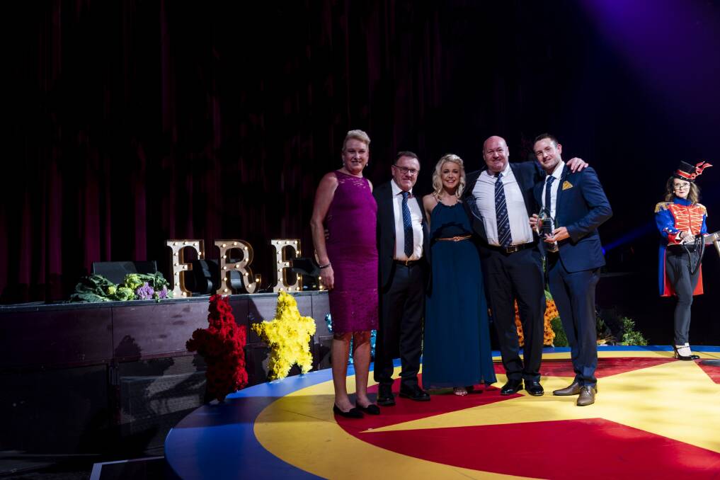 Ziggy's owners Toni an Ken Irvine and son Todd and his wife Susie at the 2019 Sydney Markets Fresh Awards accepting award for Best Medium Business. With them is the award's sponsor (second from right) and MC Chris Bath (far right).
