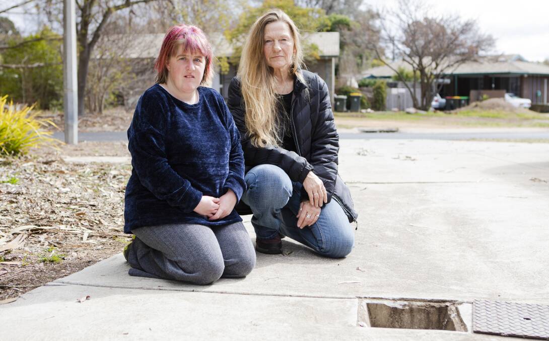 Sally Madelly and her daughter Shani Madelly, who have had several sewage overflows in the past three years at their Housing ACT residence. Picture: Jamila Toderas