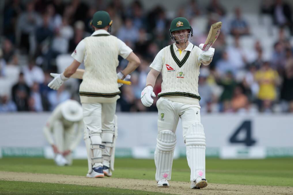 Australia's David Warner raises his bat as he reaches 50 runs on the first day of the third Ashes Test. Picture: AP