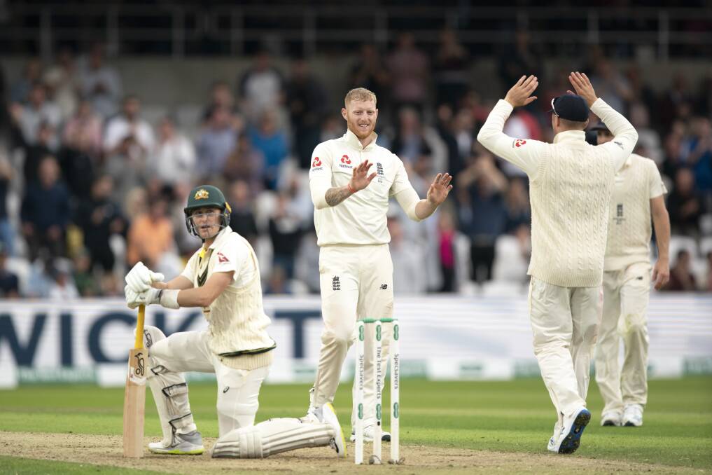England's Ben Stokes, centre, celebrates with teammates after taking the wicket of Australia's Marnus Labuschagne. Picture: AP