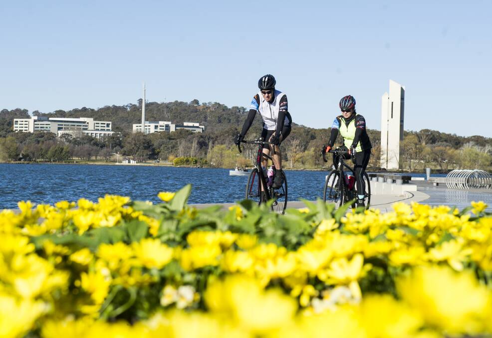 Canberrans got out and about by the banks of Lake Burley Griffin on Friday to enjoy the sunshine and warmer weather. Temperatures are expected to stick around 15 degrees all week. Picture: Dion Georgopoulos