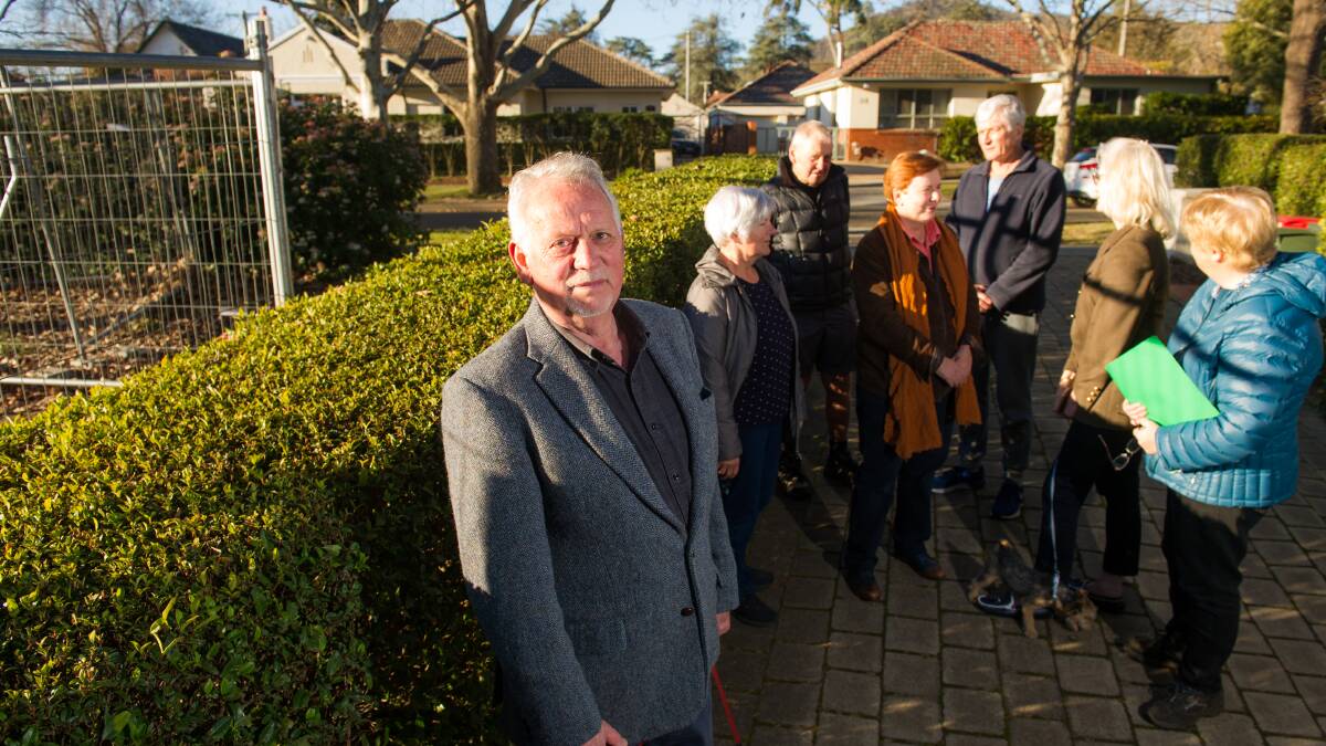 Derk Swieringa, front, with fellow members of the Reid Residents' Association next to the site where a new house has been approved, is disappointed with the process to protect the historic suburb's heritage values. Picture: Elesa Kurtz