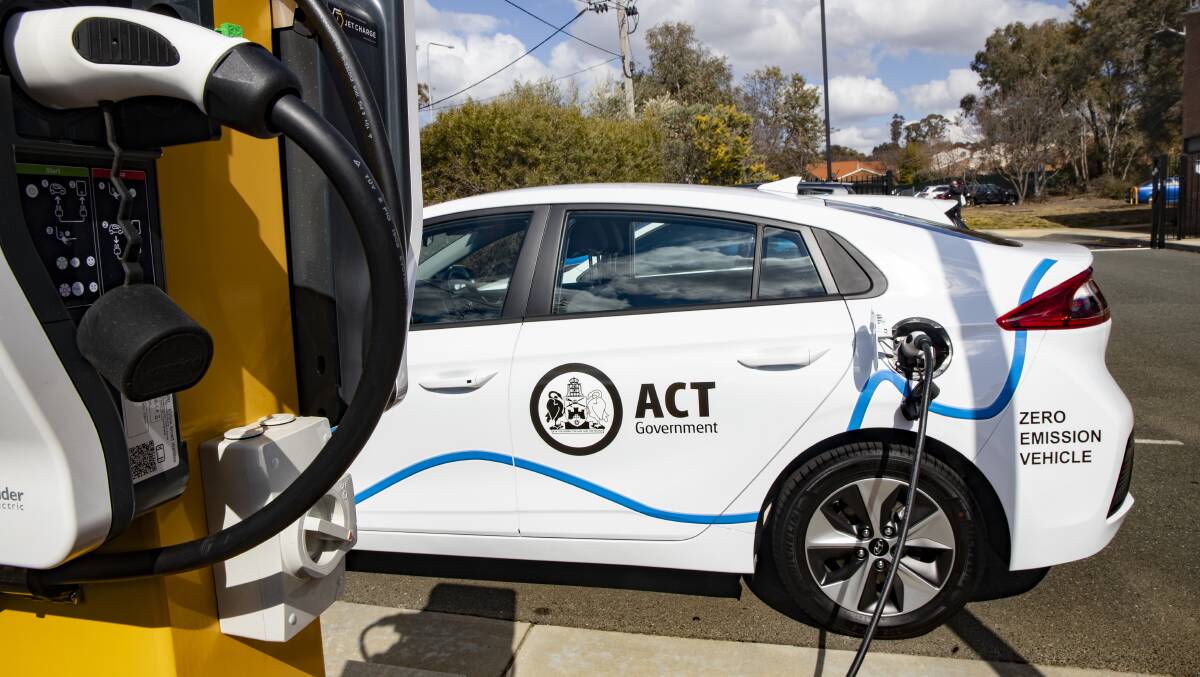An ACT government vehicle charges at a new electric vehicle charging station at the West Belconnen Child and Family Centre in Holt. Picture: Sitthixay Ditthavong