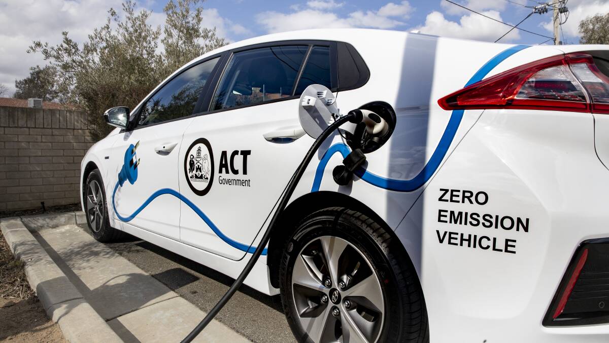 An ACT government vehicle charges at a new electric vehicle charging station in Holt. Picture: Sitthixay Ditthavong