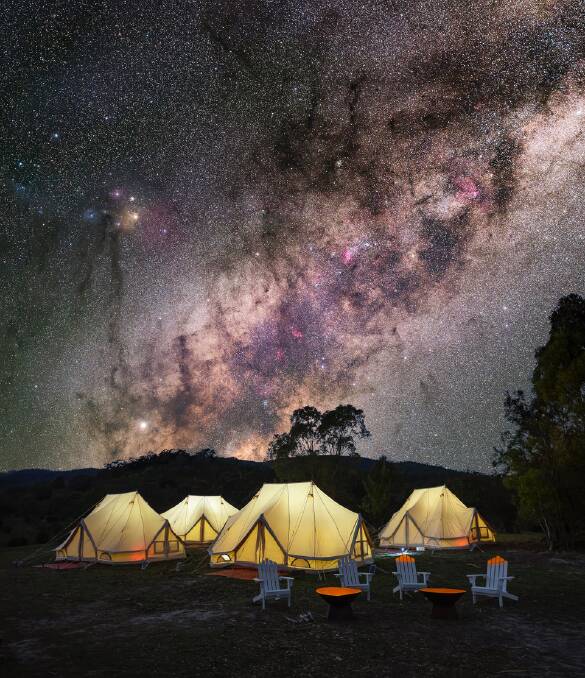 The Milky Way extends over the top of tents at Tidbinbillas Pop-Up Wilderness Camp. Picture: Ari Rex