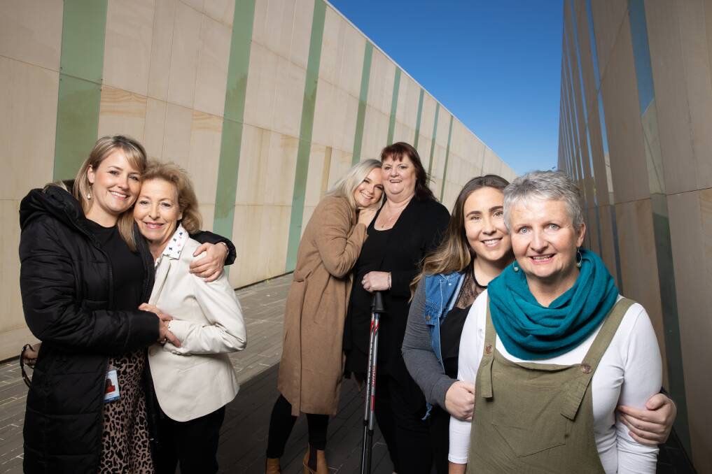 Mothers-in-arms: Jessica and Gail Stortz, Amy Peacock and Jennifer Harkness and Emma-Lawrence-Tait and Lindy Lawrence promoting A Walk in the Park for Parkinson's ACT on Lake Burley Griffin on October 20. Picture: Sitthixay Ditthavong