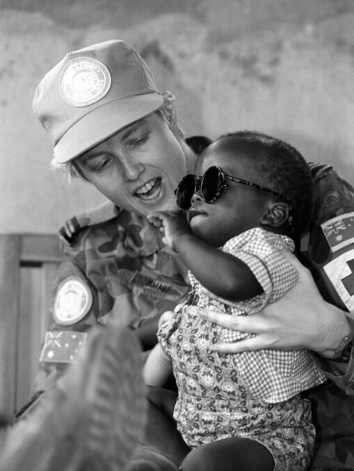 Tracy Smart at an orphangae in Rwanda in 1995. Picture: Corporal Robin White 