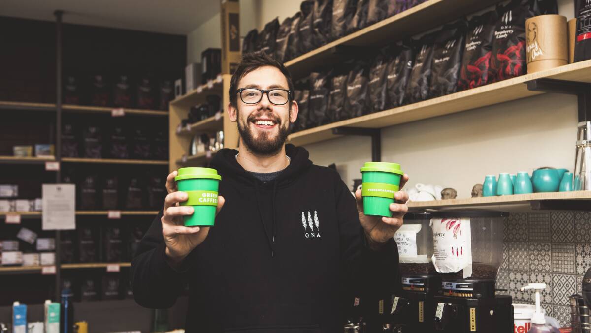 Ona executive barista Gus Mackie with Green Caffeen reusable cups. The system, founded on the South Coast, allows customers to scan, swap, drink and return the cups free of charge. Picture: Jamila Toderas