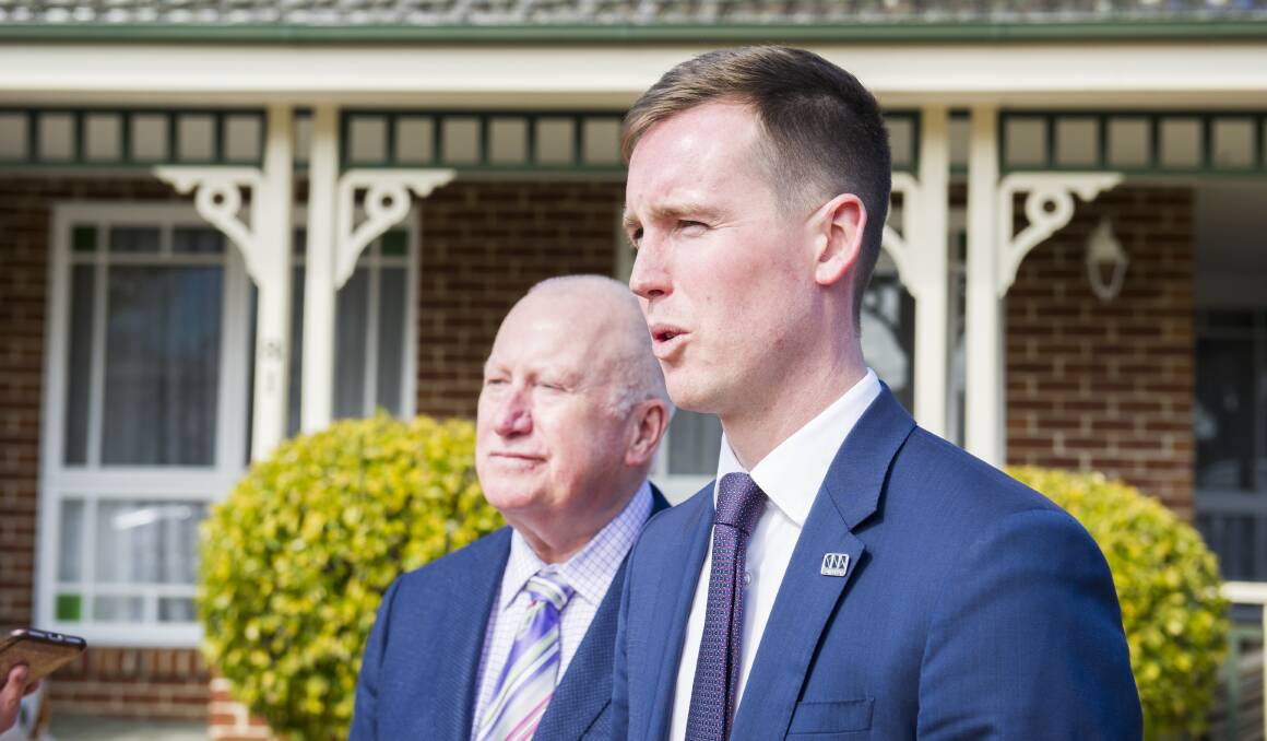 City Services Minister Chris Steel, with Brindabella MLA Mick Gentleman, at the bulky waste collection announcement in Kambah. Mr Steel said starting the service in Tuggeranong was not a decision motivated by politics. Picture: Dion Georgopoulos