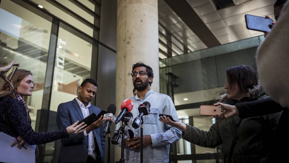 Aran Mylvaganam from the Tamil Refugee Council speaks to the media outside the Federal Court on Saturday. Picture: Chris Hopkins