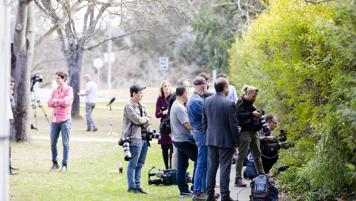 The media pack outside the home of Cameron Gill when it was raided by the Australian Federal Police last year. Picture: Jamila Toderas