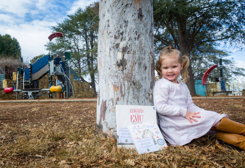 Maci Arnold, 3, of Jacka, places books around parks in Canberra to encourage reading.
Picture: Elesa Kurtz
