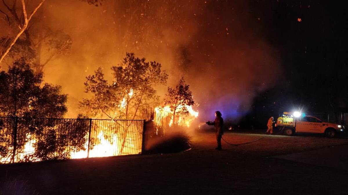 Firefighters battling a blaze at Peregian Springs on the Sunshine Coast. Picture: John Park