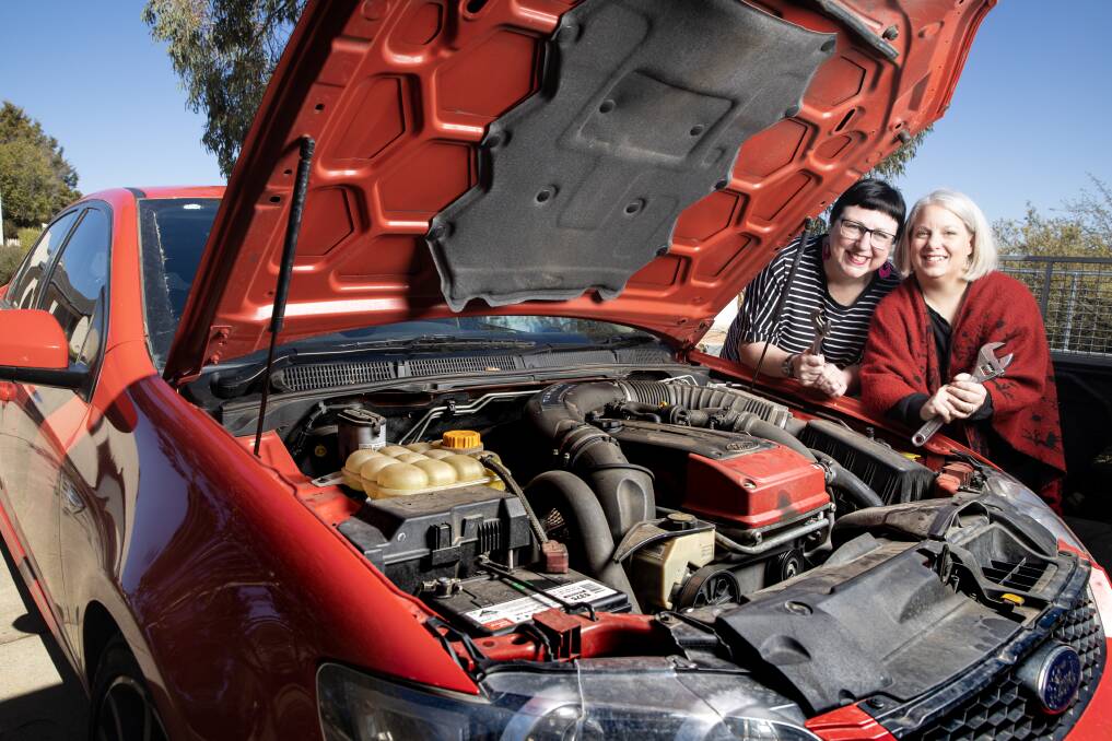 Canberra locals Yvette Rydman (left) and Amanda Feuerborn, who have created the Facebook group Girl Power - Car Basics and are in the process of starting workshops to teach women basic mechanics. Picture: Sitthixay Ditthavong