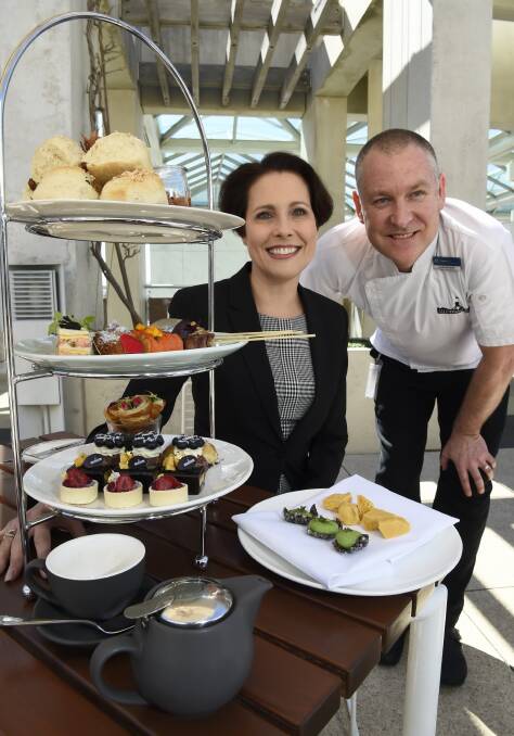 Parliamentary Services acting deputy secretary Cate Saunders and Parliament House's executive chef David Learmonth (above) with the mouth-watering high tea. Picture: Graham Tidy, AUSPIC