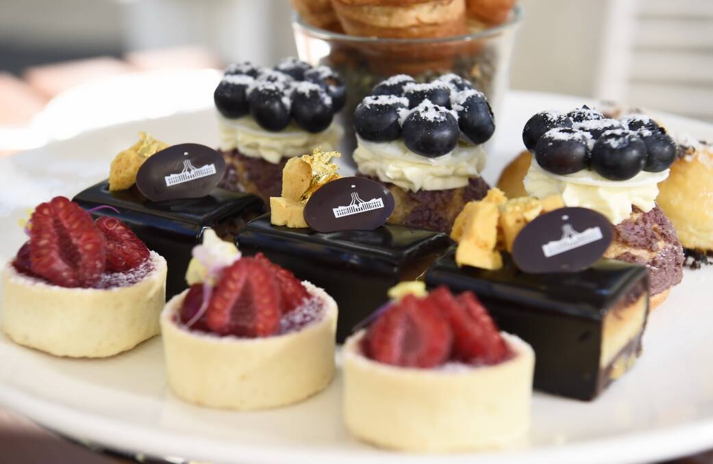 Raspberries, chocolate and blueberries on the sweet side of the high tea. The chocolate dessert with gold leaf and APH chocolate plaque is an upmarket play on a Twix chocolate bar. Pictures: Graham Tidy, AUSPIC
