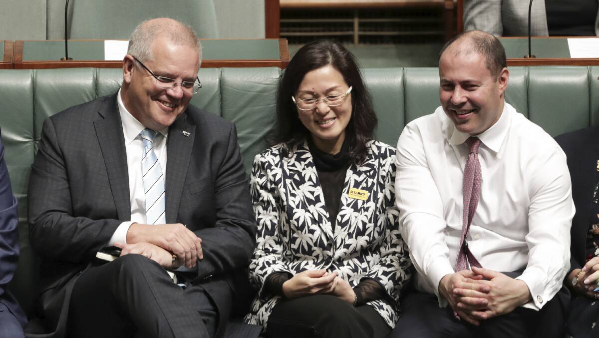 Liberal Gladys Liu is flanked by Prime Minister Scott Morrison and Treasurer Josh Frydenberg in Parliament House this week. Picture: Alex Ellinghausen