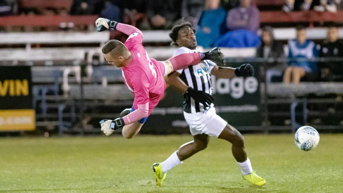 Cooma Tigers keeper Jakob Cole was sent off in the first half after making a dangerous challenge to Gungahlin's Micheal John, opening the floodgates for a Jeremy Habtemariam masterclass. Picture: Sitthixay Ditthavong