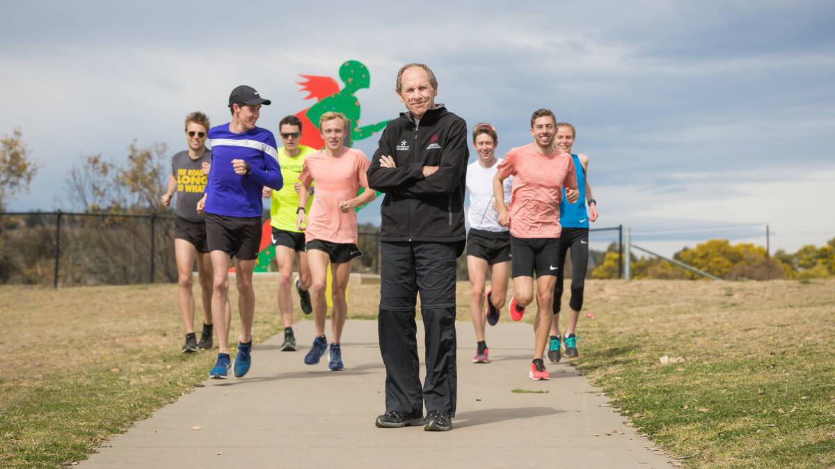 Sport scientist and running coach Dick Telford, centre, says gradually easing into training is the key to success. Picture: Sitthixay Ditthavong