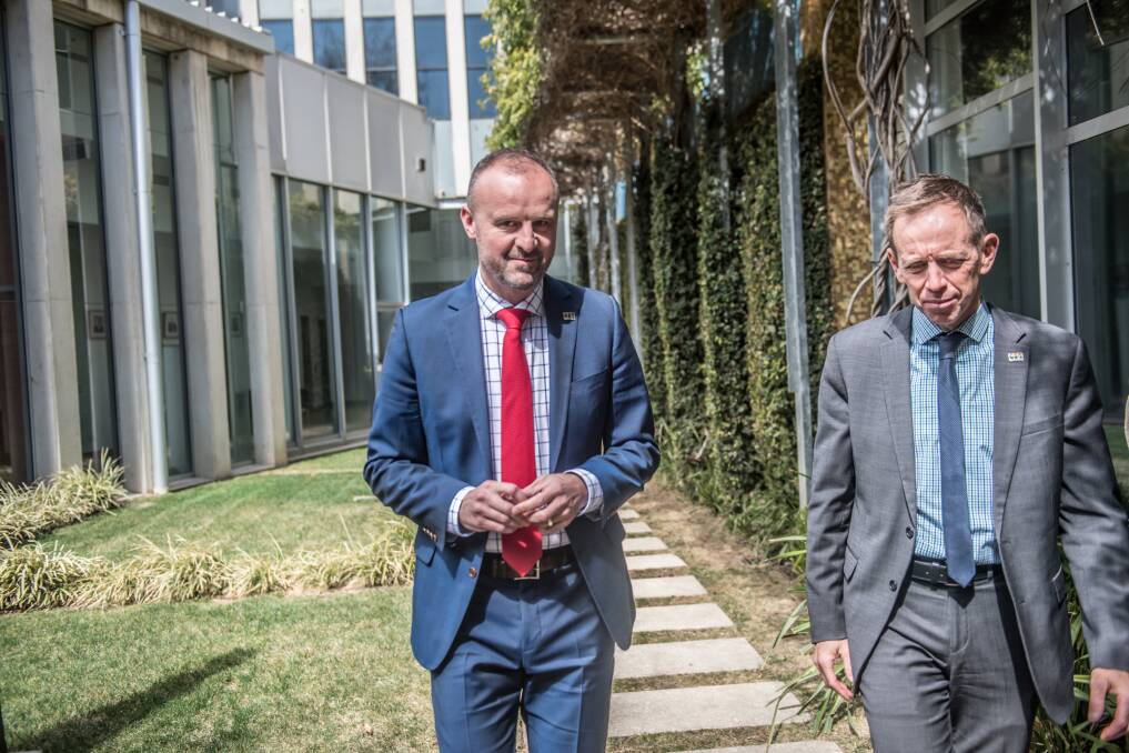Chief Minister Andrew Barr and Greens leader Shane Rattenbury, walking side-by-side into the courtyard of the ACT Legislative Assembly to announce the territory's climate action plan on September 16 last year. Picture: Karleen Minney