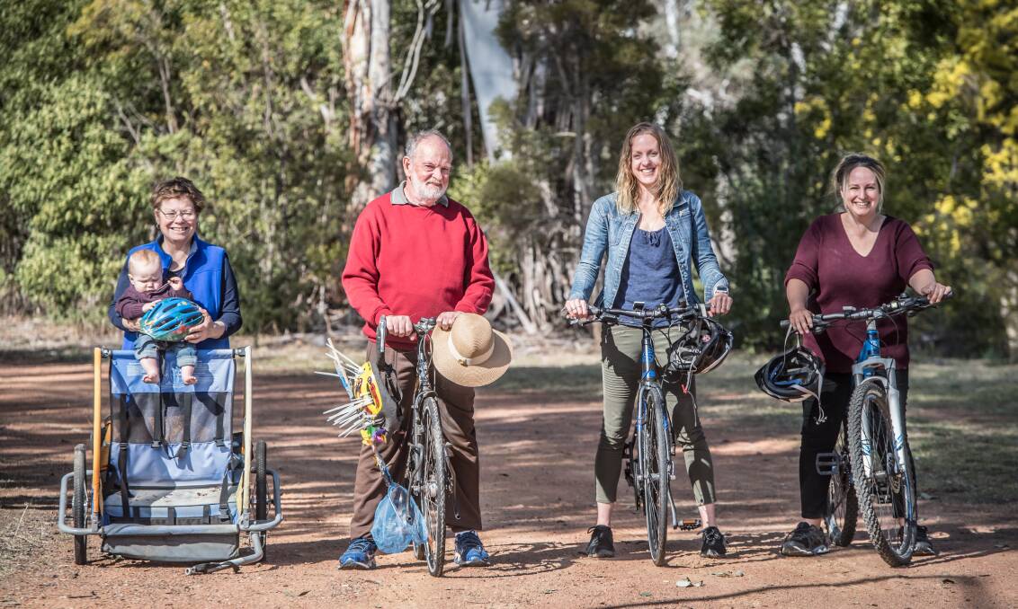 The Mason family, Nancy, holding grandson James, John, and daughters Nadezhda and Anna, who do their absolute best to avoid using cars in favour of cycling or public transport to commute. Picture: Karleen Minney