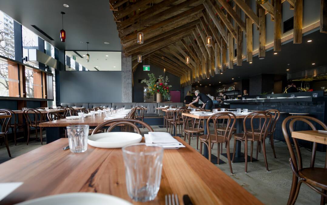 The restaurant has repurposed wooden beams from Bega Flats for the ceiling and tables. Picture: Elesa Kurtz