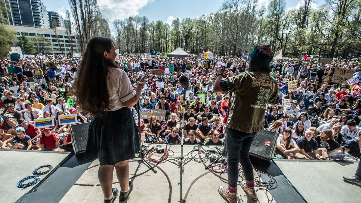 Olivia Boddington, 16 and Amelia Hollo, 13, address a crowd of thousands at the September climate strike. Picture: Karleen Minney