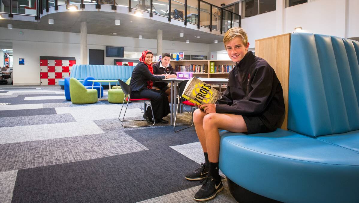 Belconnen High School year 10 students, from left, Malek Elfeky, Isaak Lyons and Campbell Marris in the learning commons. Picture: Elesa Kurtz