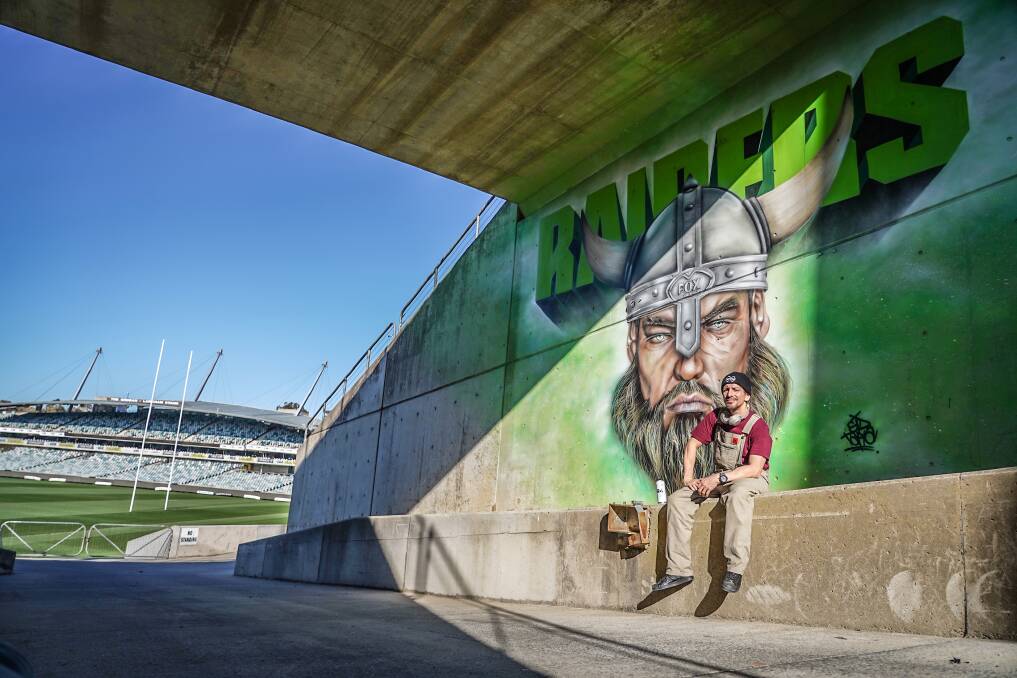 Mural artist Sid Tapia spent four days at Canberra Stadium to complete a new Canberra Raiders mural ahead of the team's preliminary final against the South Sydney Rabbitohs. Picture: Reiner Schuster