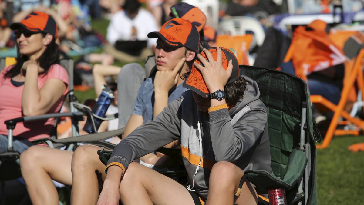 Western Sydney Giants fans watch in horror as the Giants take a beating. Picture: James Alcock