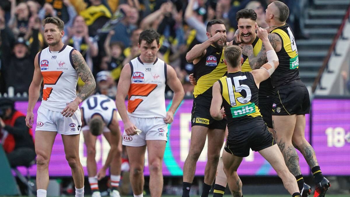 Ivan Soldo of the Tigers is congratulated by his teammates after kicking a goal during the 2019 AFL Grand Final. Picture: Scott Barbour