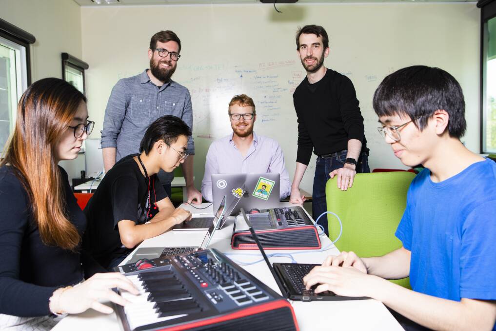 As the ANU School of Music launches its new orchestra, it's also expanding it's "laptop" ensemble. Students (front) Janice Yap, Tom La, (behind left) Weitong Huang, with Lecturers (behind) Composition lecturer Alexander Hunter, Computer Science lecturer's Ben Swift, and Charles Martin. Picture: Jamila Toderas