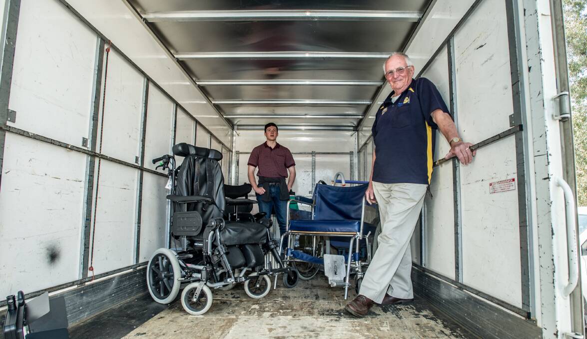 Fred Fawke and his grandson Kyle Fawke, 19, pick up wheelchairs from Technical Aid to the Disabled ACT. Picture: Karleen Minney