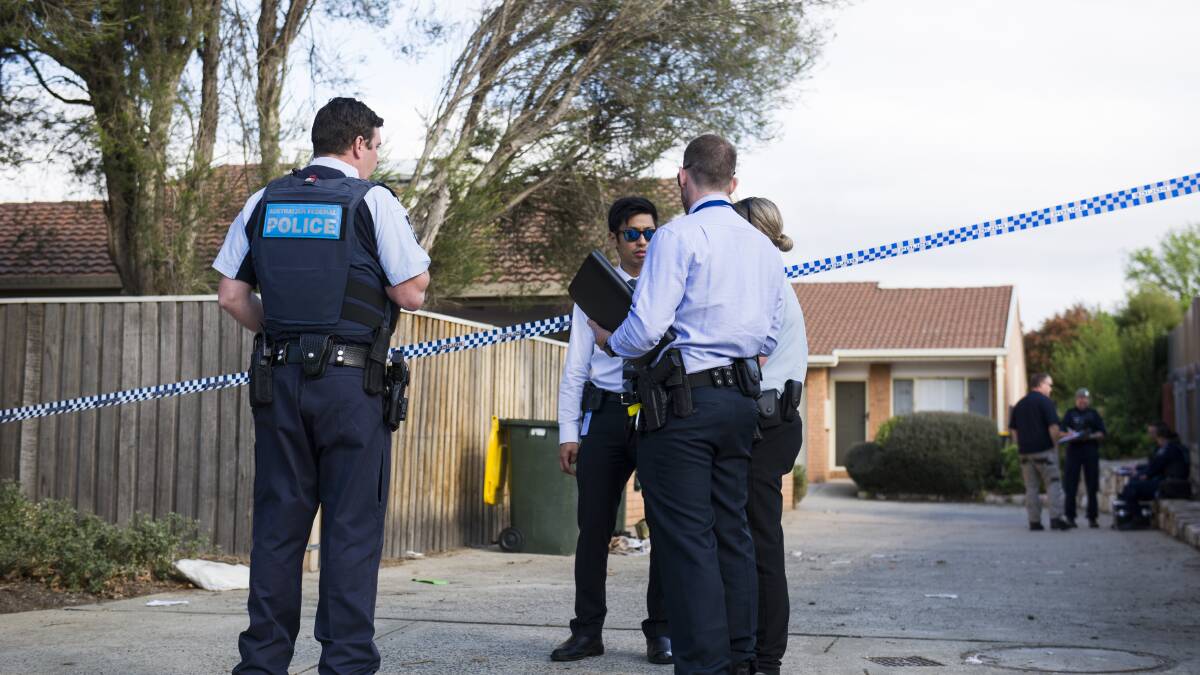 Police and detectives at a crime scene in Palmerston. Picture: Dion Georgopoulos