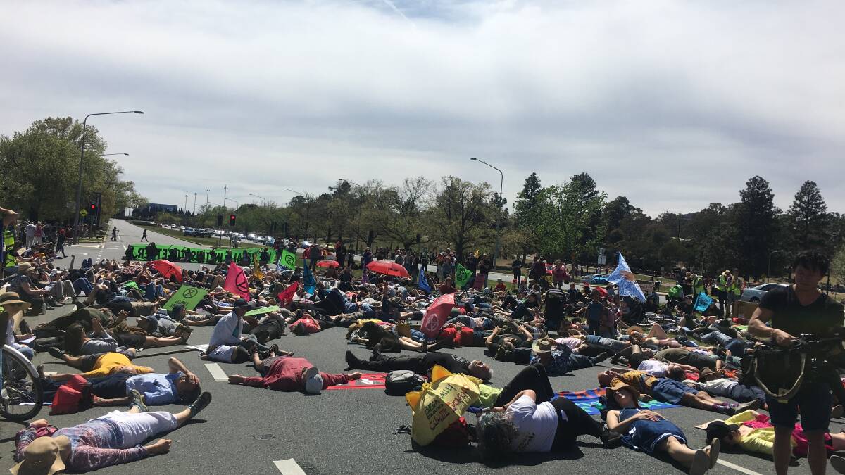 Protesters take over Commonwealth Avenue in protest of climate change inaction. Picture: Peter Brewer