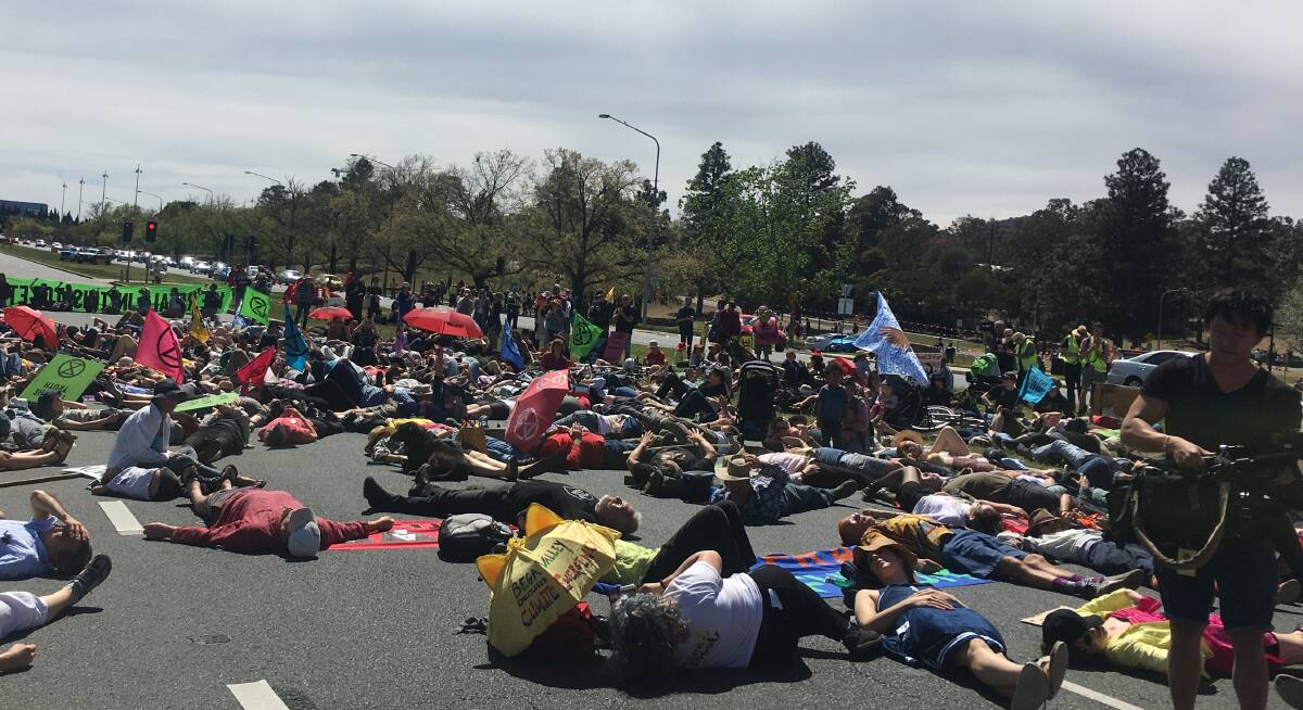 Great gesture but will it change anything? Protesters took over Commonwealth Avenue in protest at climate change inaction. Picture: Peter Brewer