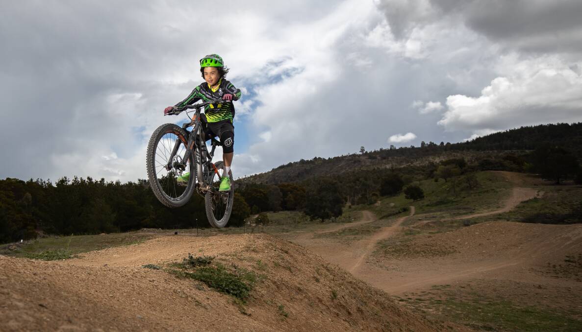 Obi Channing, 12, hits the mountain bike trails at Mount Stromlo during training with riding school Dynamic Motivation. Picture: Sitthixay Ditthavong