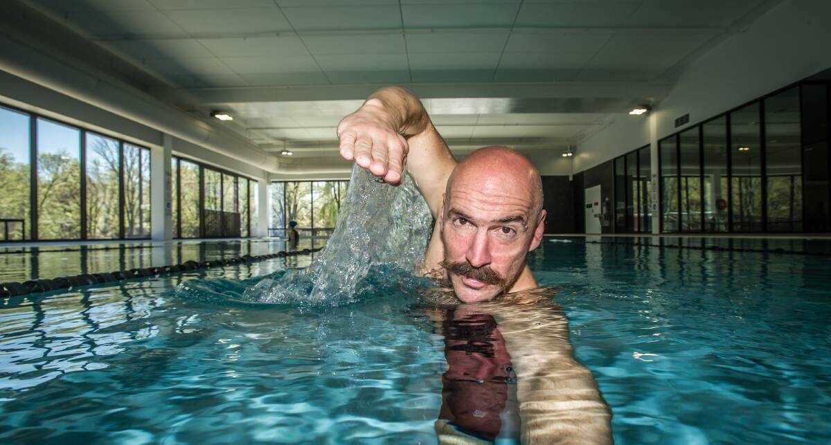 Kenton Webb swimming in pool number 521 at the Australian National University this week. Picture: Karleen Minney