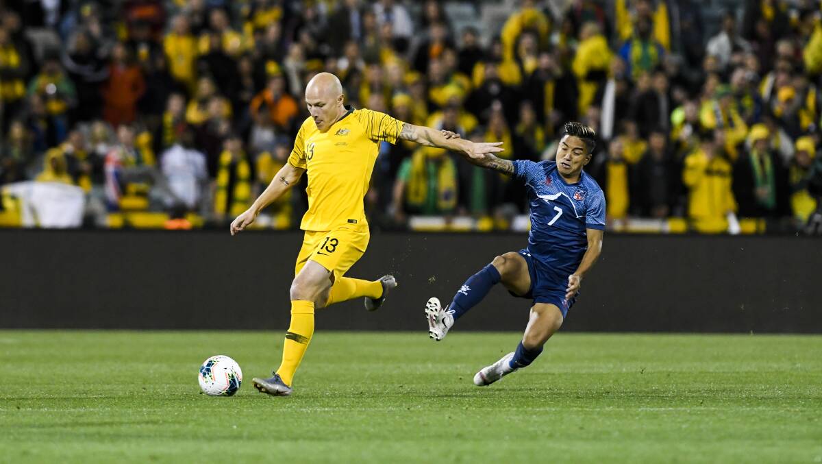 Aaron Mooy in action against Abishek Rijal. Picture: Dion Georgopoulos