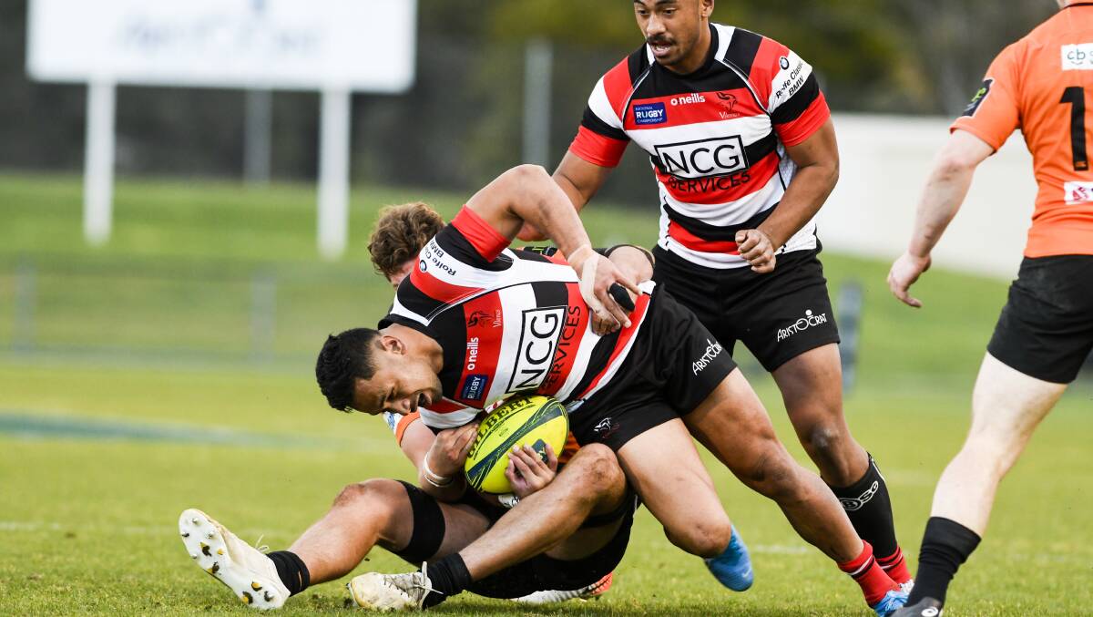 Canberra Vikings' Toni Pulu is brought down NSW Country's defence. Picture: Dion Georgopoulos